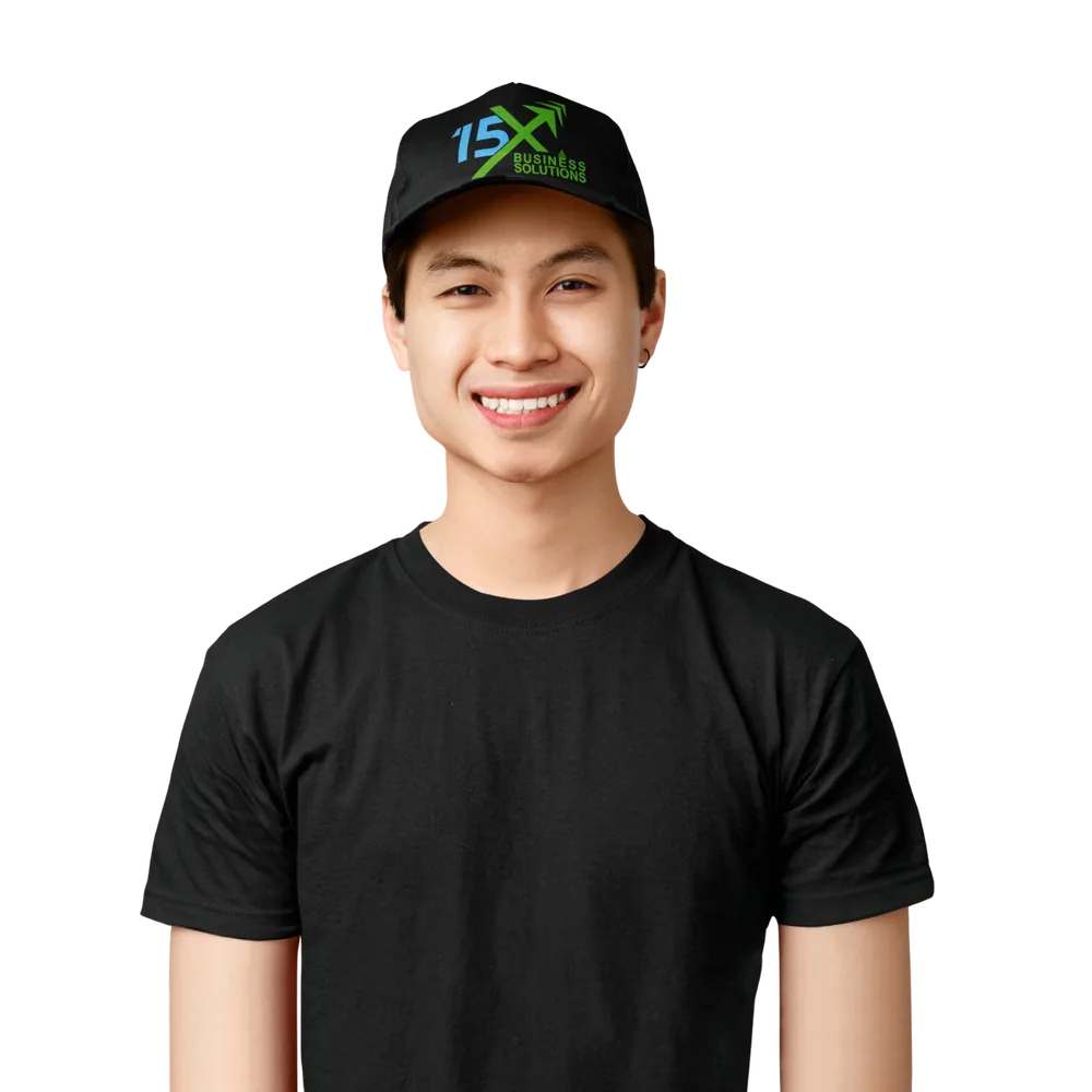 Smiling man wearing a black 15X Business Solutions cap and T-shirt