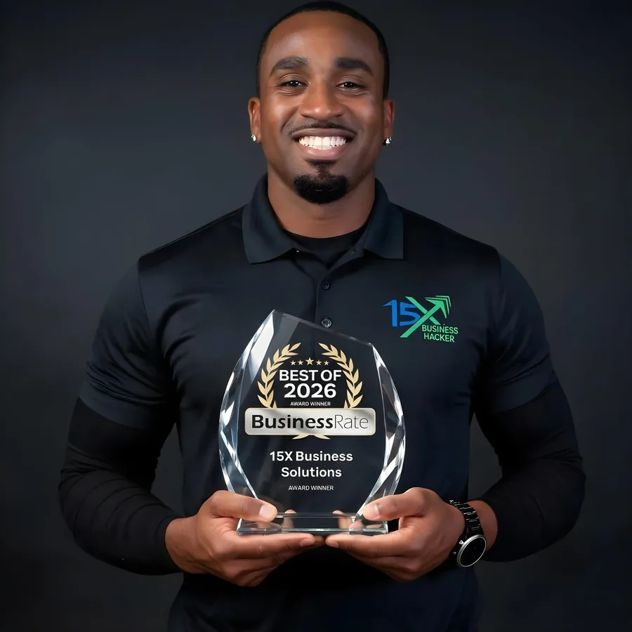 Person in a 15X Business Solutions polo shirt holding the Best of 2026 BusinessRate award